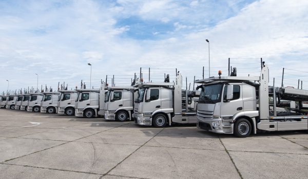 Group of trucks parked in line at truck stop. Group of trucks parked in line at truck stop.